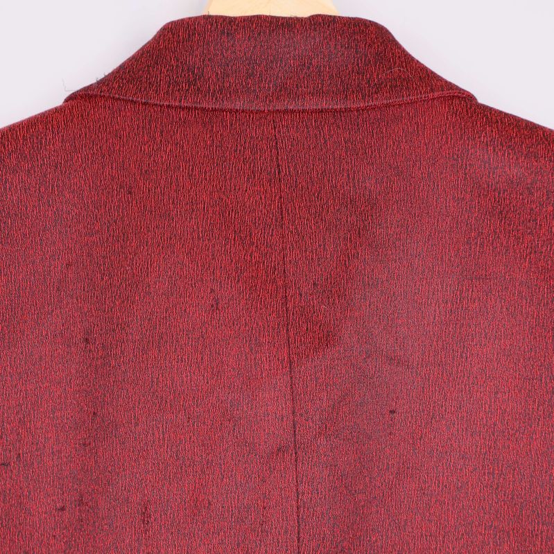 Ryggpartiets textur och sömmar på kavajen