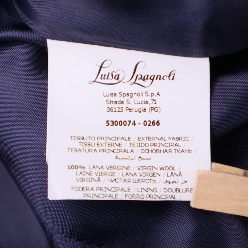 Materiallapp med texten 100% virgin wool