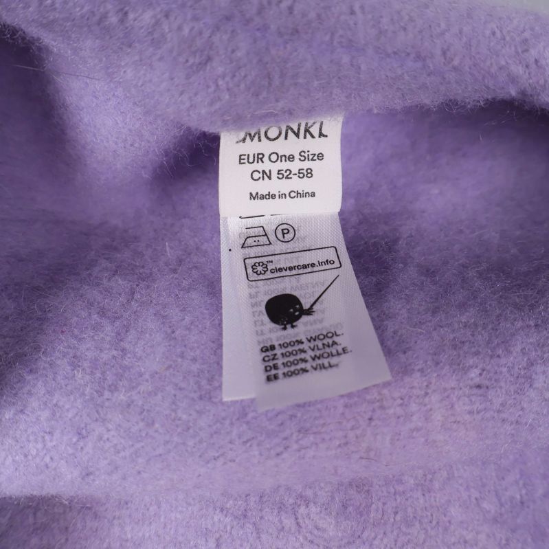 Material- och tvättrådsetikett för ljuslila basker