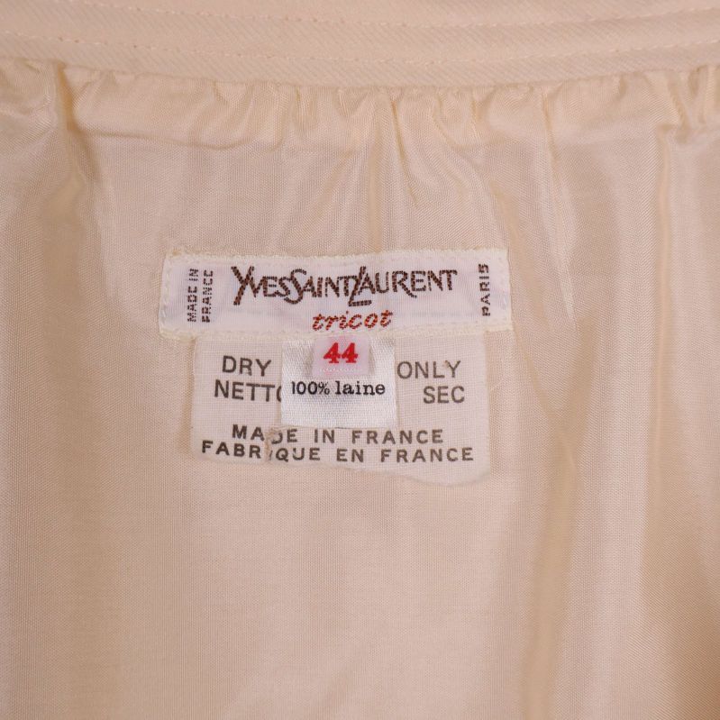 Etikett med Yves Saint Laurent tricot och materialinfo