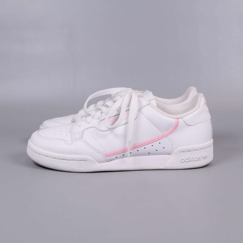 Sneakers i vitt med rosa detalj, sidovy