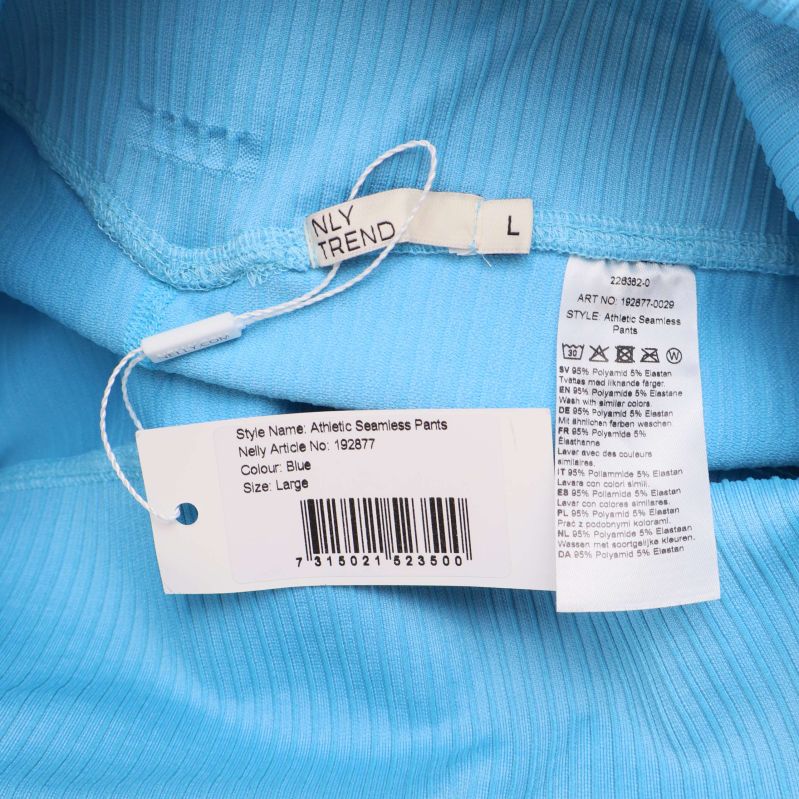 Tvättråd och storleksetikett för blå ribbade leggings