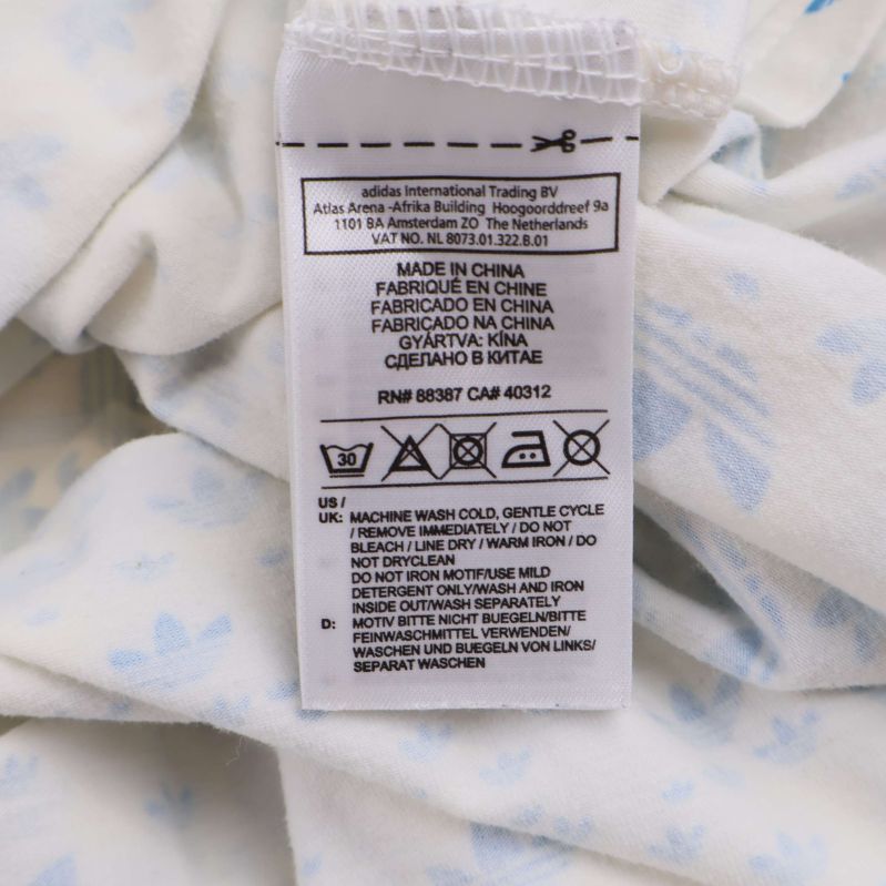 Närbild på skötsel- och materiallapp inuti linnet