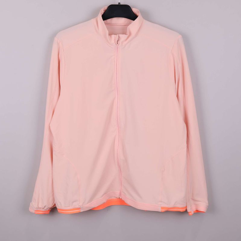 Ljus aprikos jacka med dragkedja och hög krage framifrån