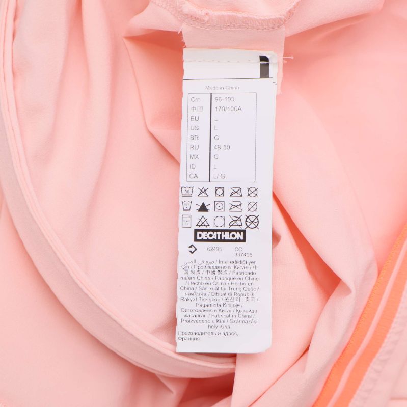 Material- och tvättanvisning med Decathlon på innertagg