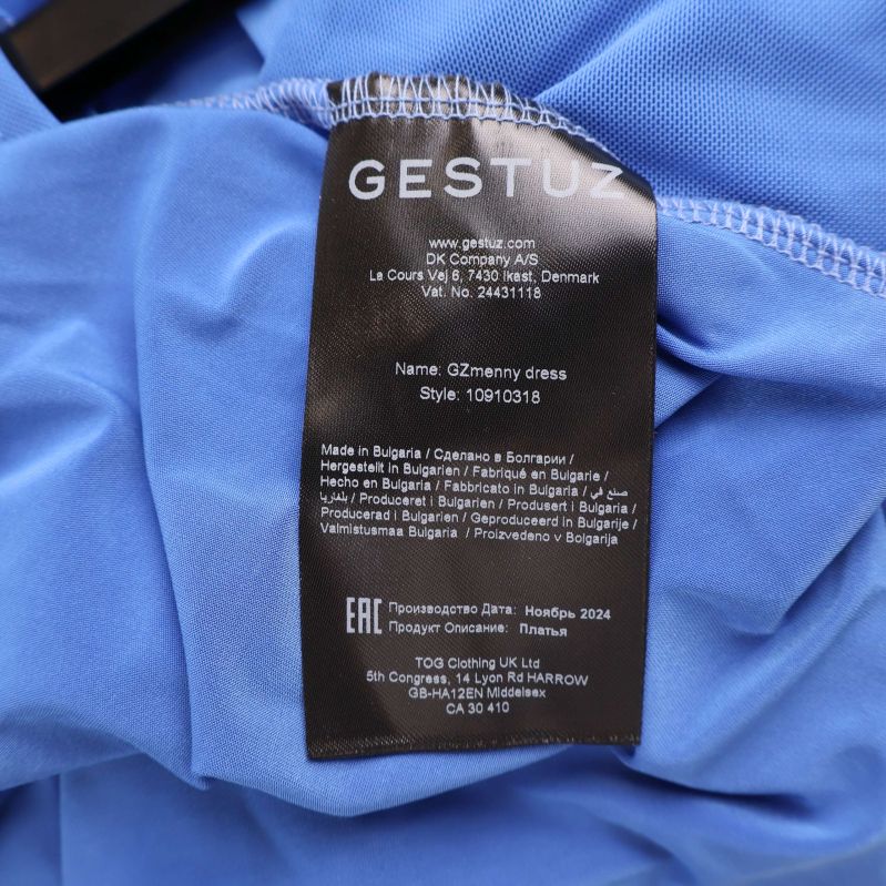 Material- och tvättlapp för Gestuz klänning