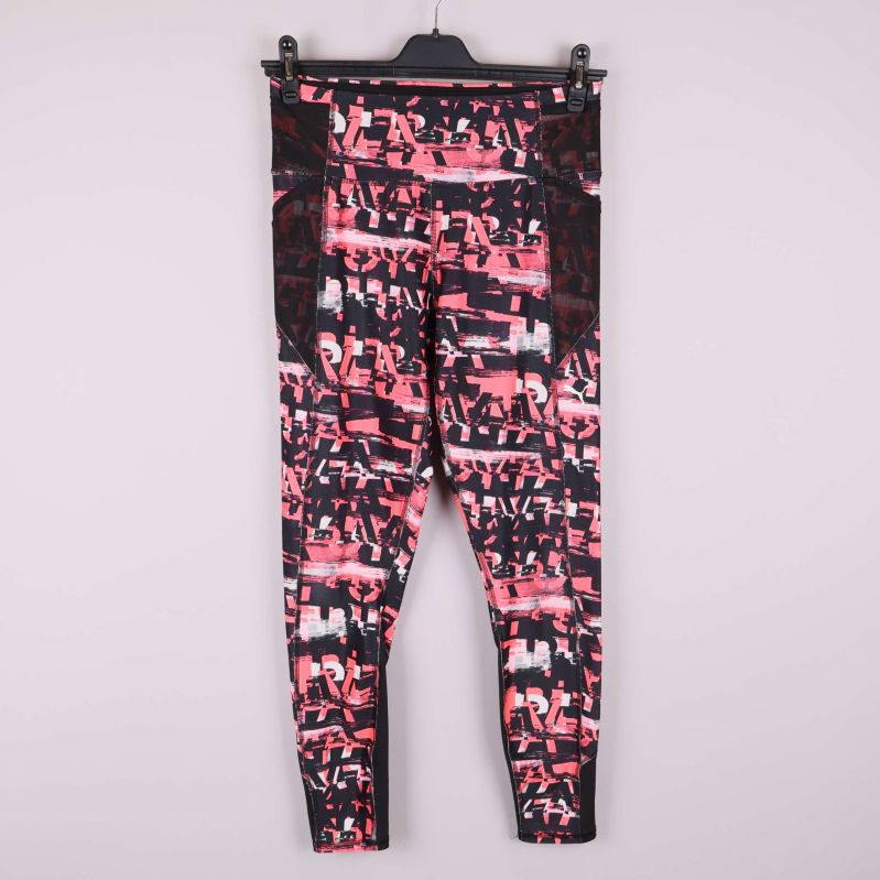 Träningstights med rosa och svart grafiskt mönster framifrån