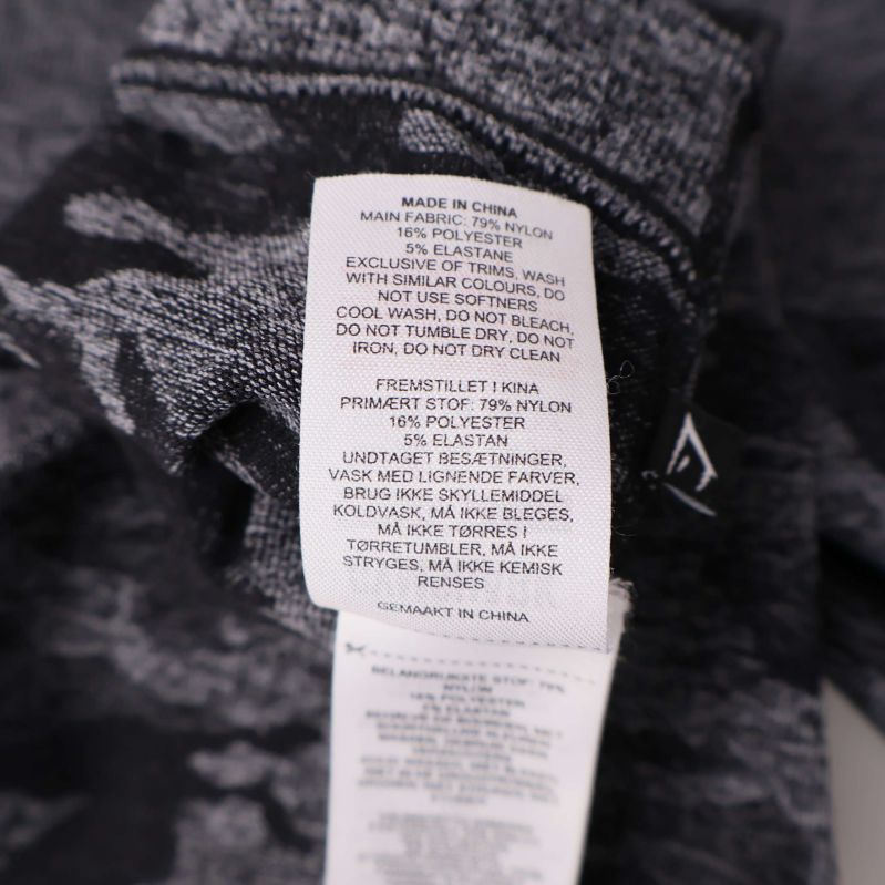 Materialetikett som visar sammansättning på tightsen