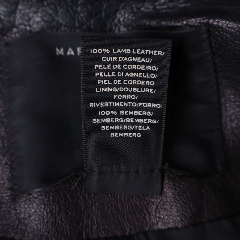 Materiallapp visar 100% lammläder och 100% s.k. bemberg foder