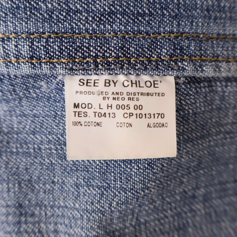 Materialetikett som visar 100% bomull