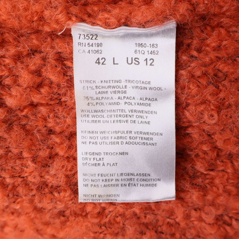 Materialetikett visar ull, alpacka och polyamid