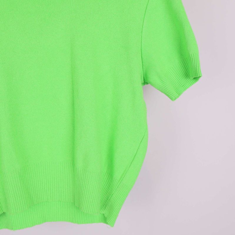 Närbild på grön jumpers ärm