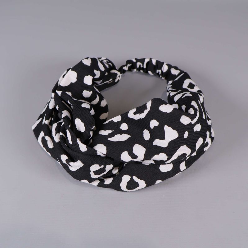 Svart hårband med vitt djurmönster i elastisk design
