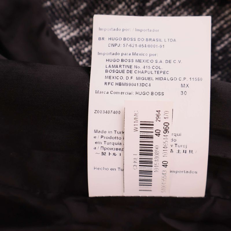 Importetikett med information om tillverkare och ursprung