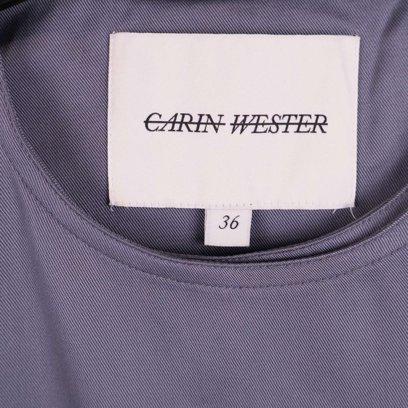 Närbild på Carin Wester-märkesetikett och storlek 36