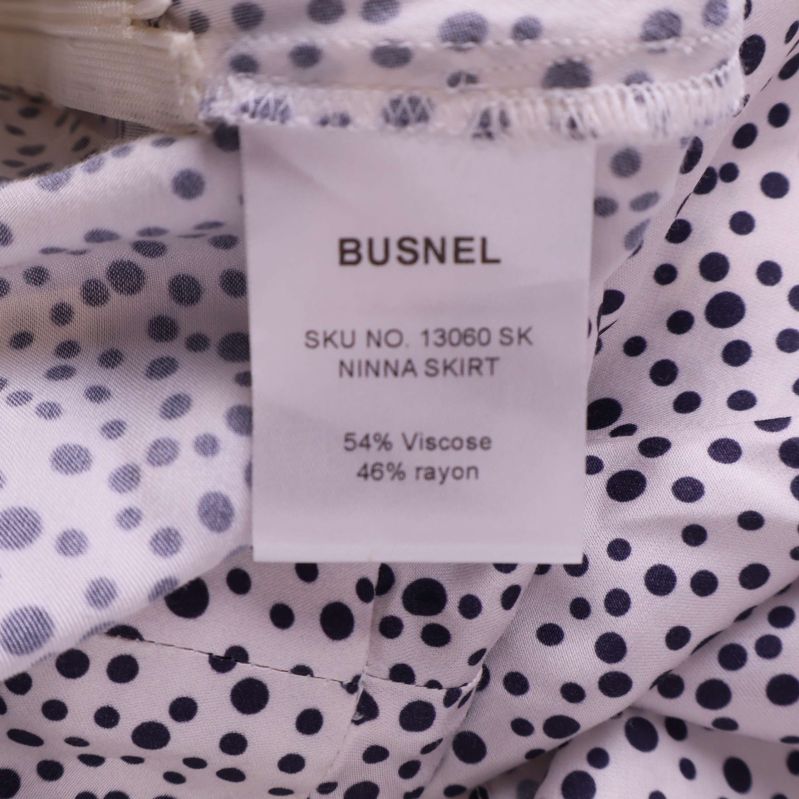 Materialetikett som visar 54% viskos och 46% rayon