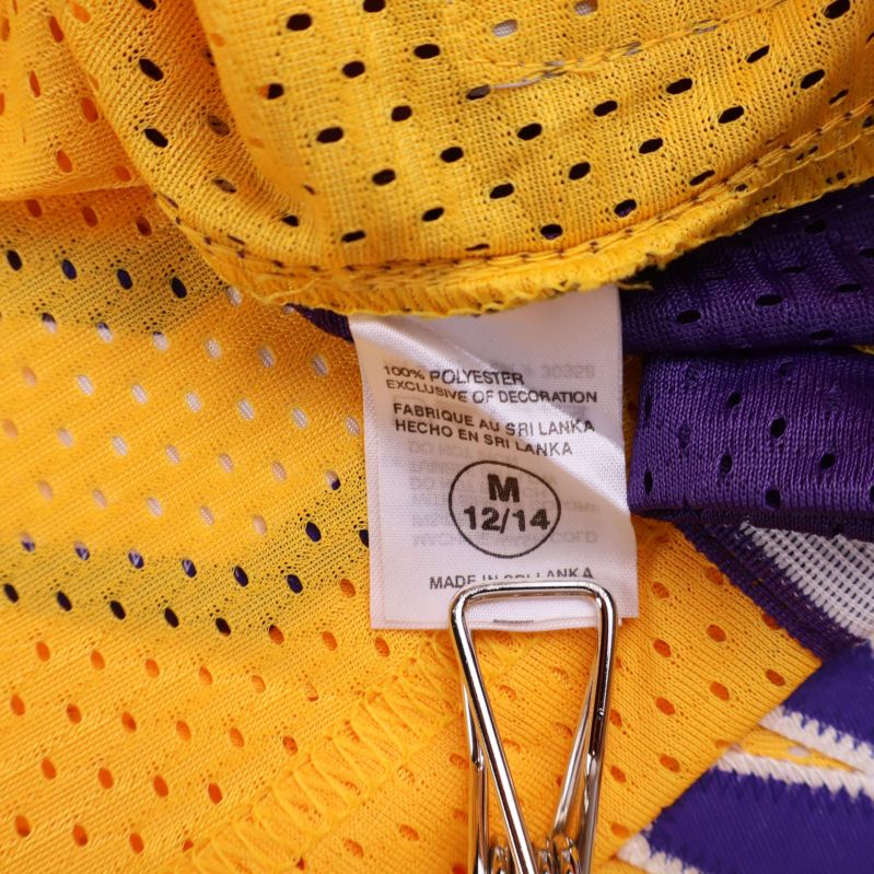 Insydd materiallapp med polyesterinformation och storlek M 12/14