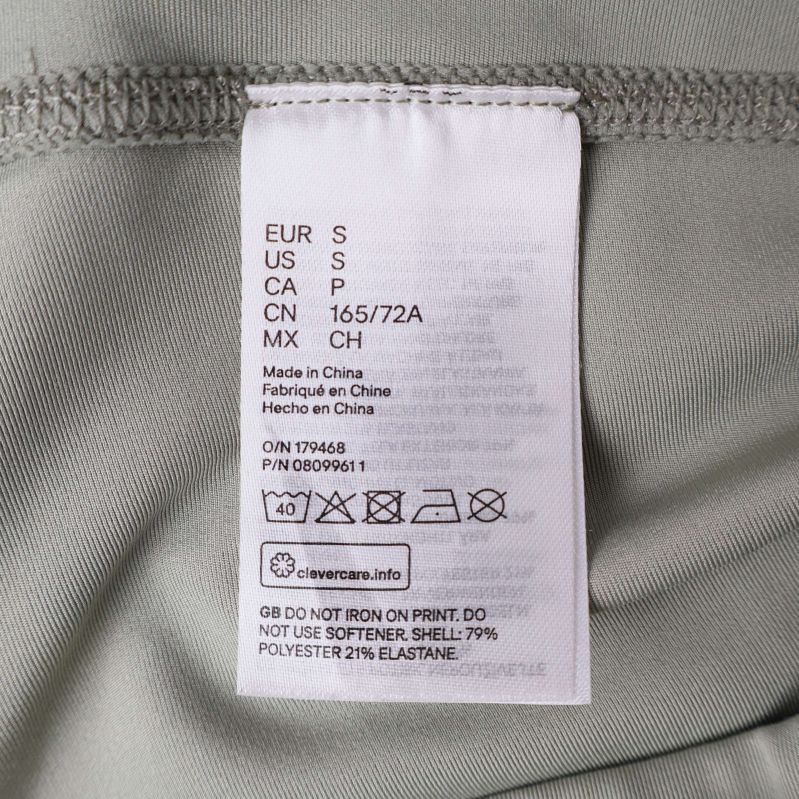 Materiallapp med information om polyester och elastan