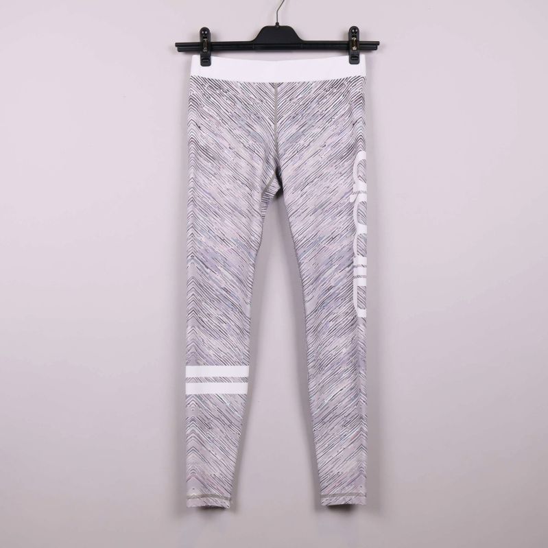 Tights med grafiskt mönster och vit linning framifrån