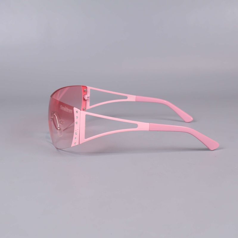 Solglasögon i rosa sedd från sidan med dekorativa stenar