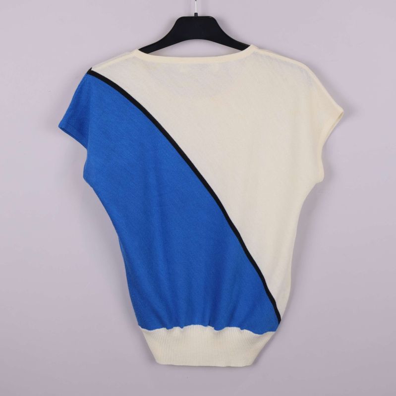 Baksida av topp med blå och creme färgblock