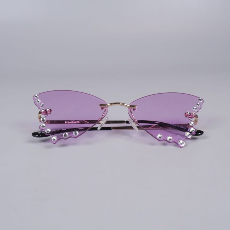Solglasögon ihopvikta visar lila glas och strass