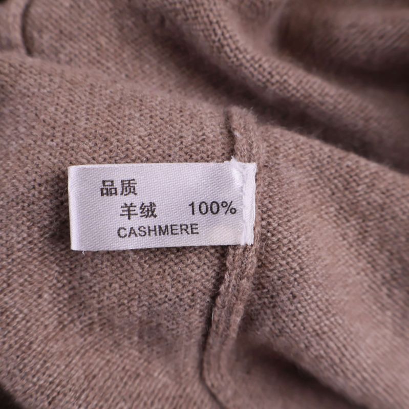 Materiallapp med texten 100% cashmere