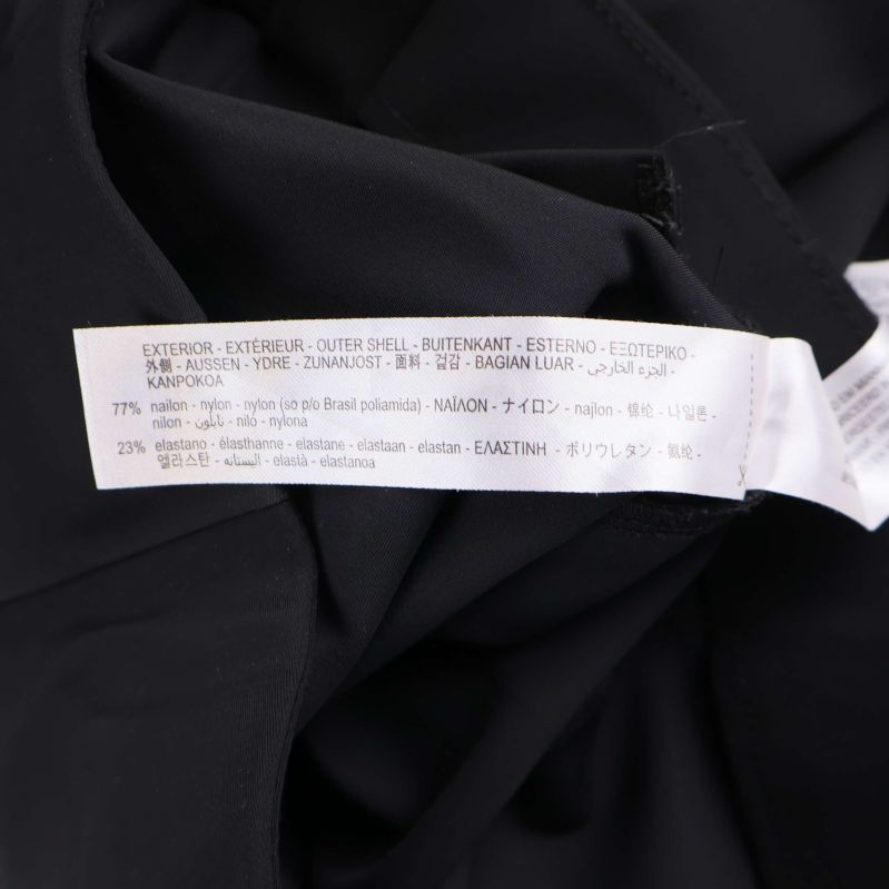 Materialetikett som visar nylon, bomull och elastan