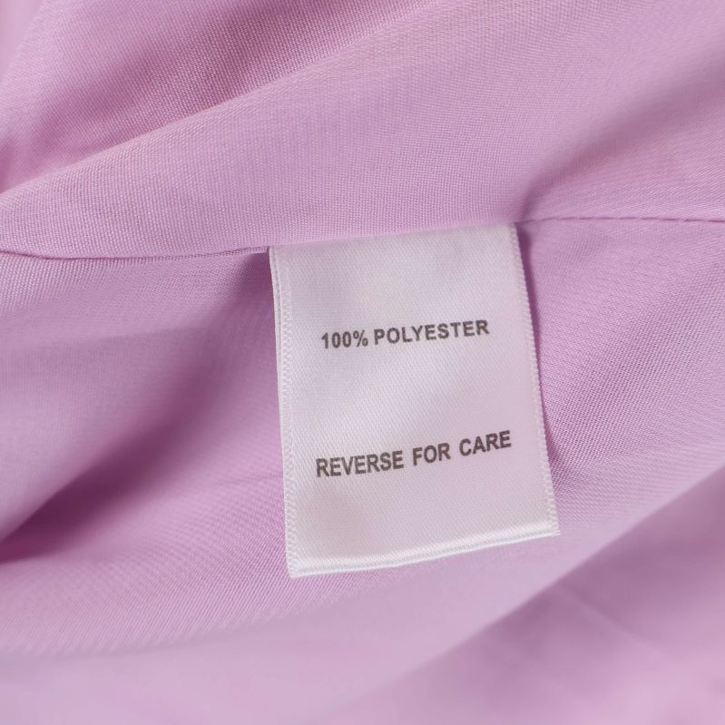 Materiallapp med information om 100% polyester