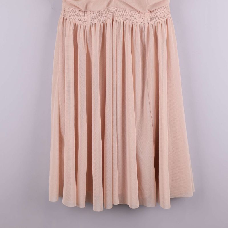 Nederdel av klänning med plisserad kjol