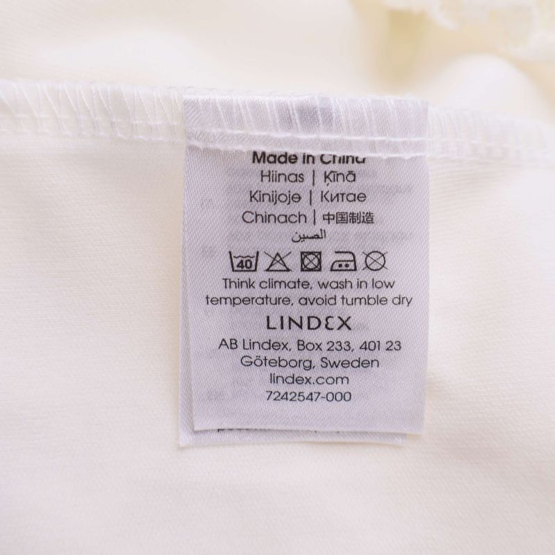 Tvättlapp som visar Lindex och tillverkningsinformation