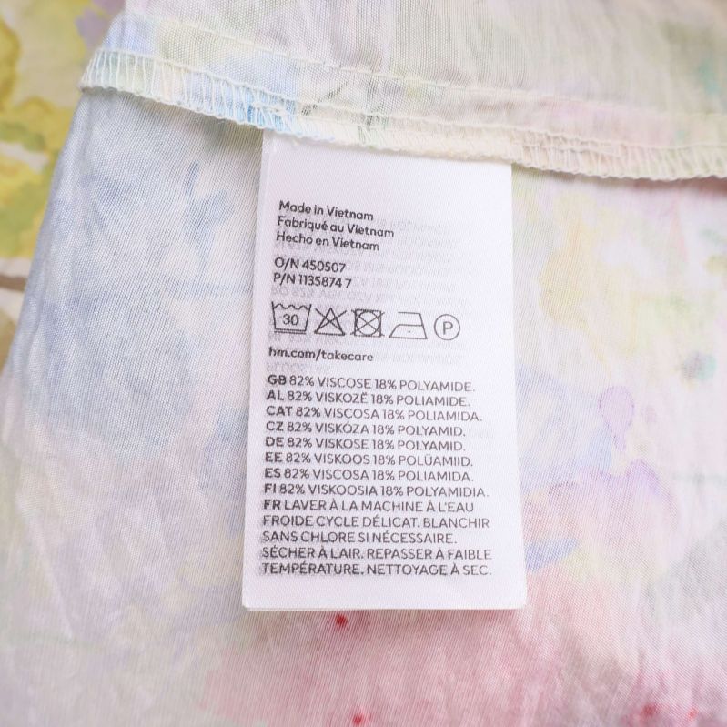 Materialetikett med sammansättning och tvättråd