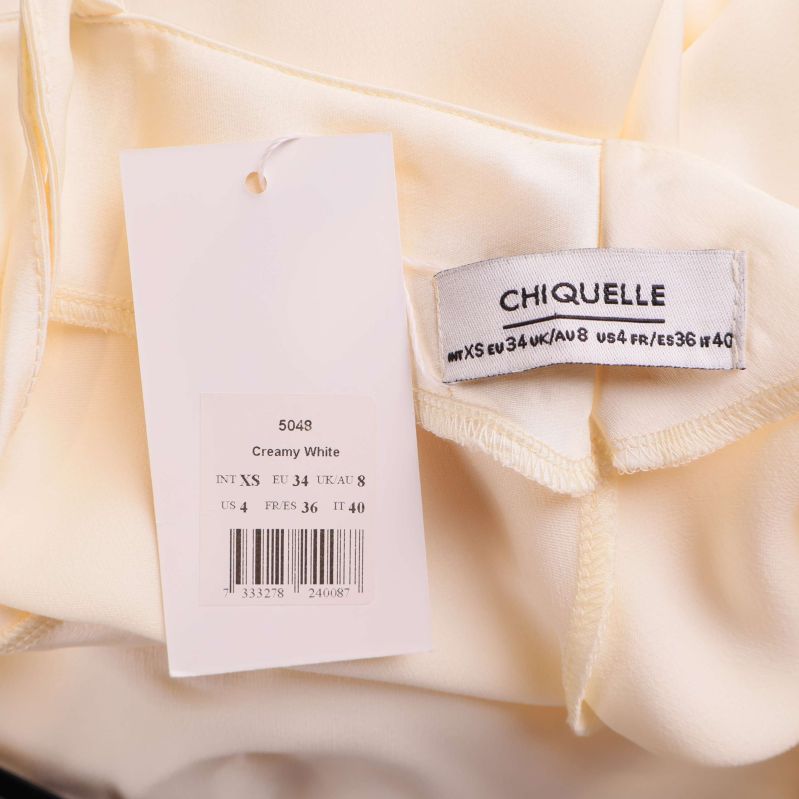 Etikett med varumärket Chiquelle och storleksangivelser