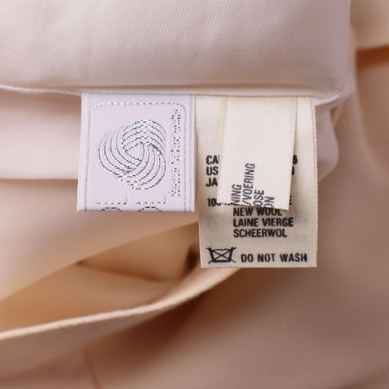 Materiallapp med information om ull och skötselråd