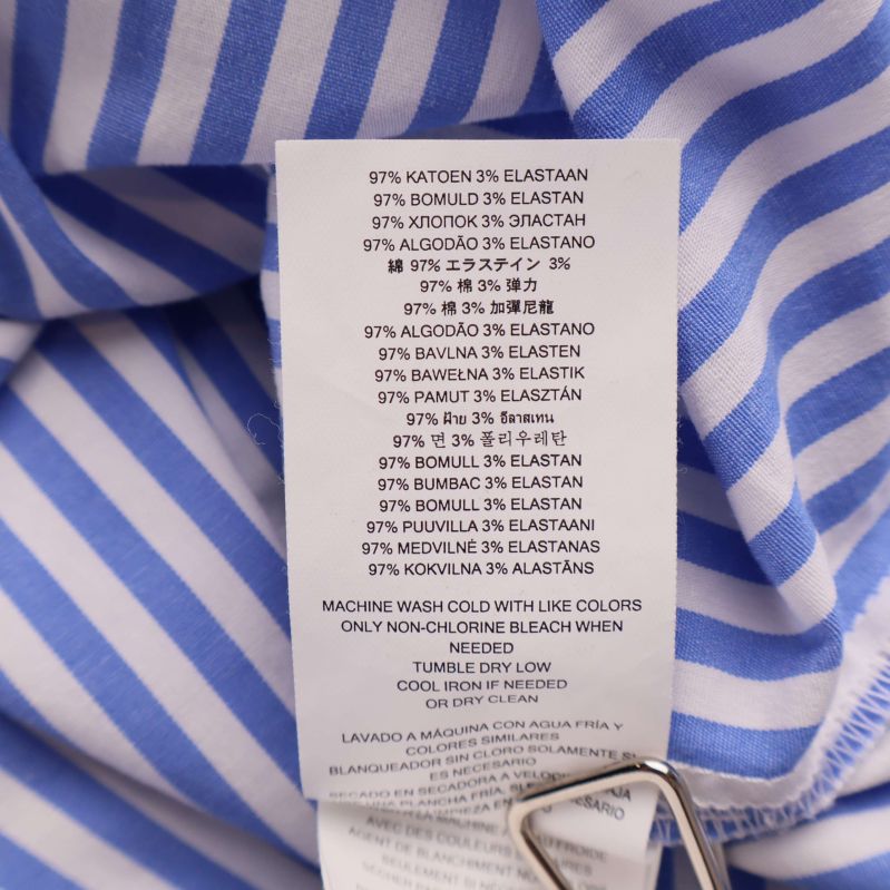 Materialetikett visar 97% bomull och 3% elastan