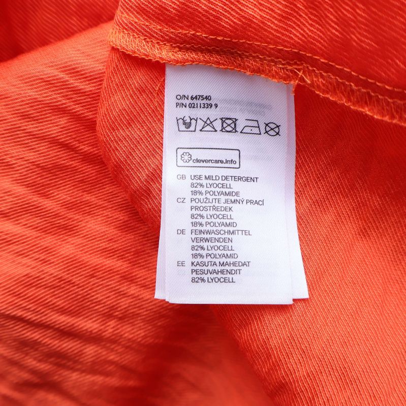Materiallapp: 82% lyocell 18% polyester