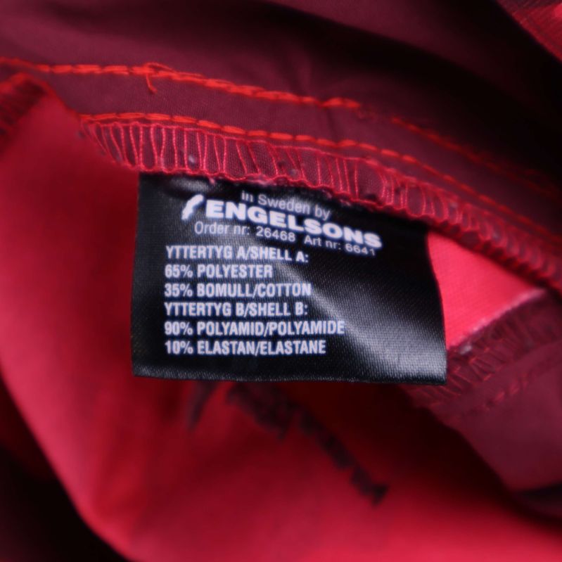 Materiallapp med information om tygsammansättning