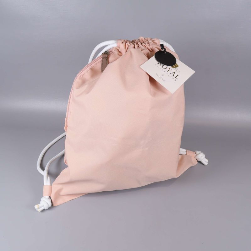 Ryggsäck i aprikos med vita snören framsida