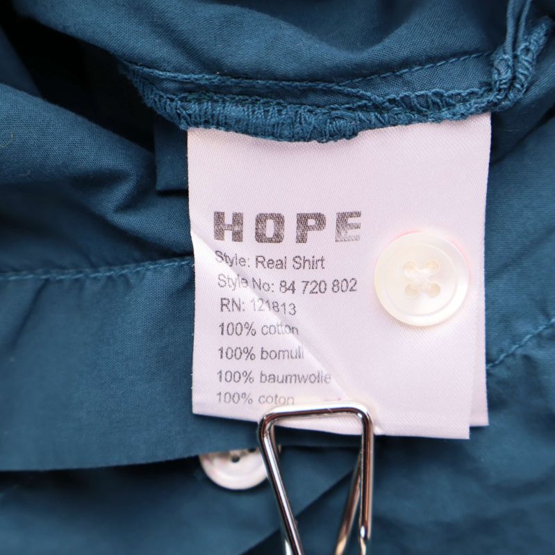 Materiallapp visar 100 procent bomull