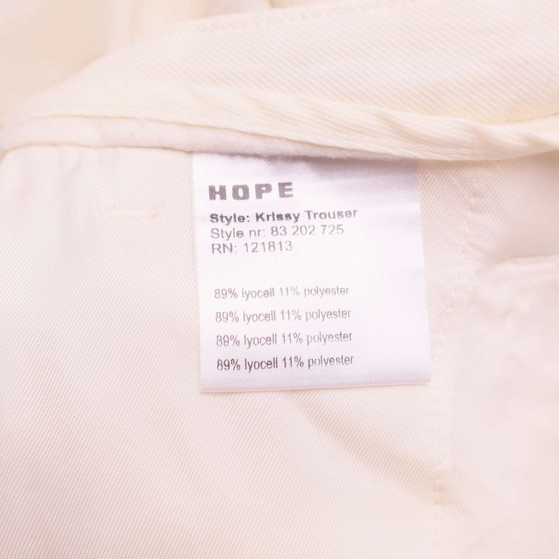 Etikett med HOPE och storlek 34 WOM/44 MAN