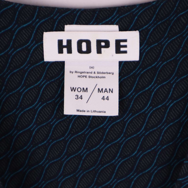 Närbild på HOPE-märke och storleksinfo 34/44