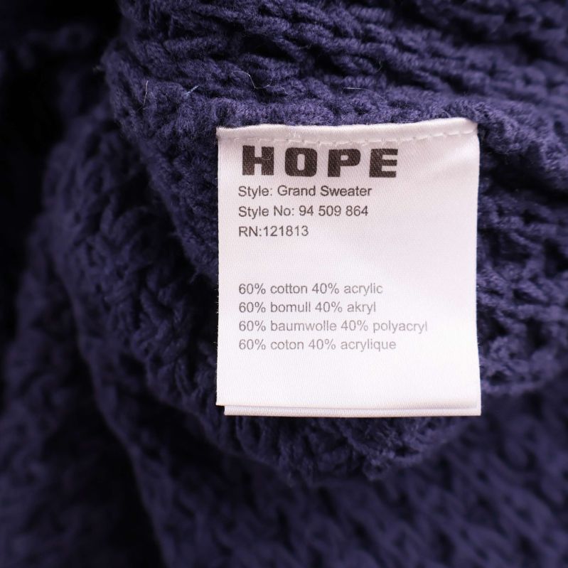 Etikett med materialinformation: 60% bomull, 40% akryl