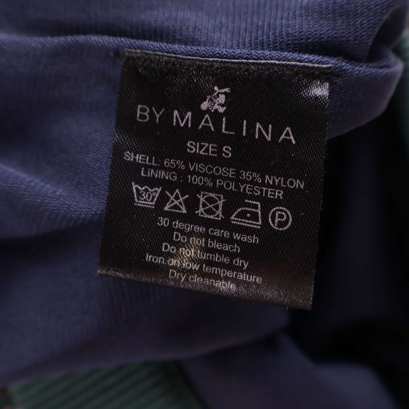 Materialetikett visar 65% viskos och 35% nylon, foder 100% polyester