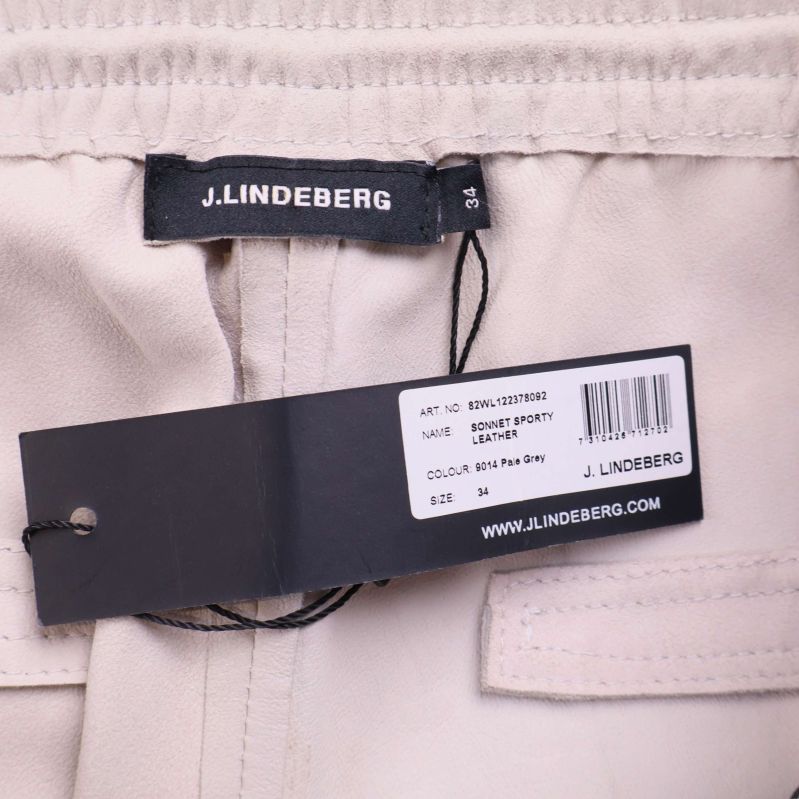 J.Lindeberg logga samt etikett med modell och färg