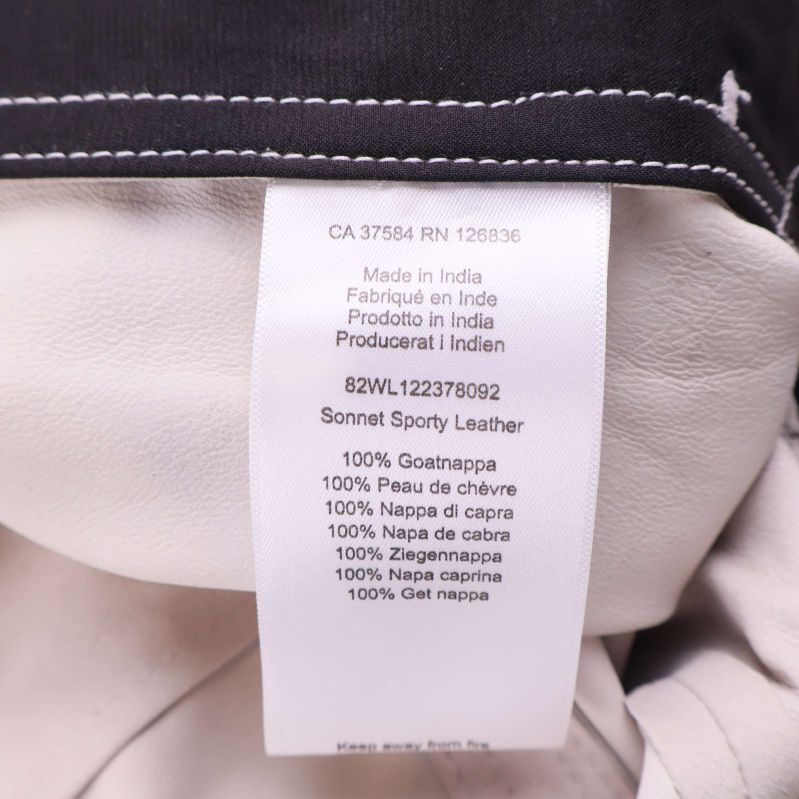 Materialetikett med information om 100% getskinn