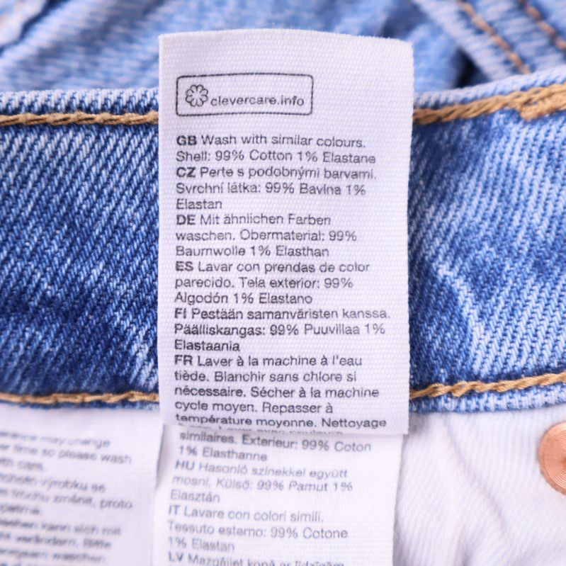 Materiallapp som visar 99% bomull och 1% elastan