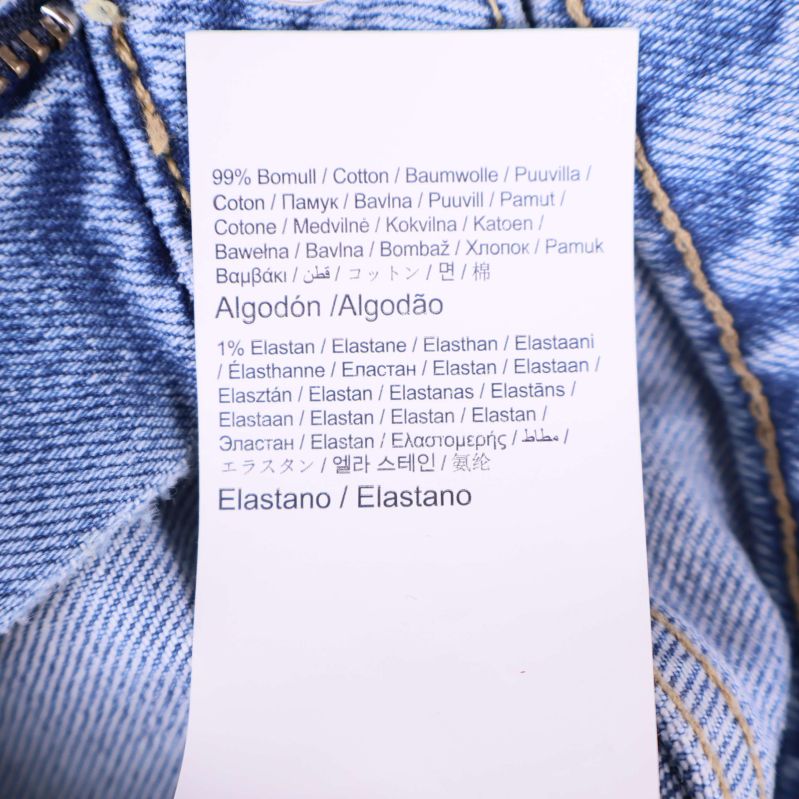 Materiallapp med information om bomull och elastan