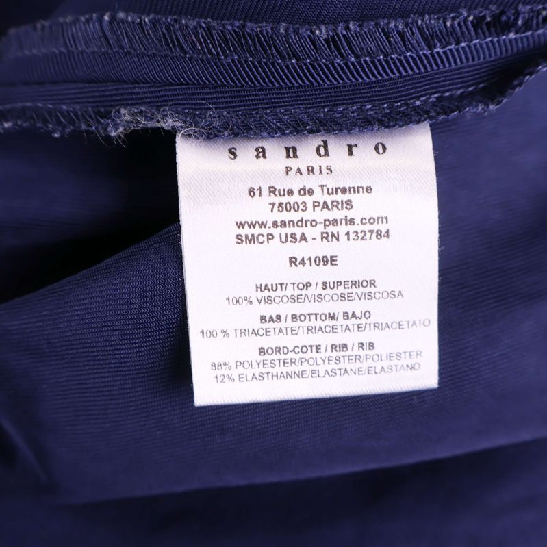 Material- och skötselrådsetikett från Sandro Paris