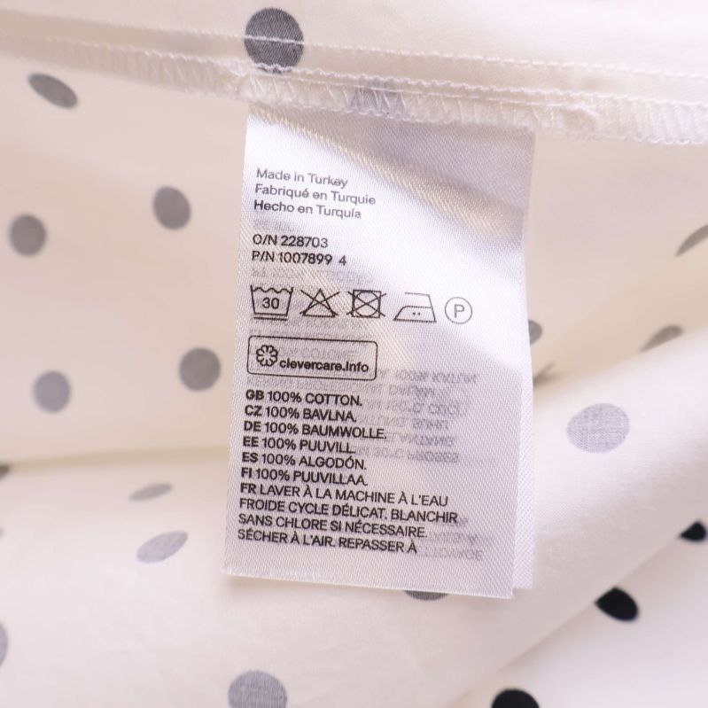 Materialetikett visar 100% bomull