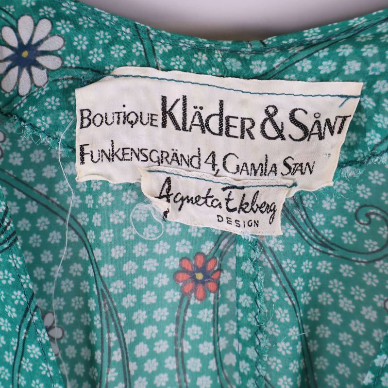 Detaljerad närbild av etikett, Agneta Ekberg Design